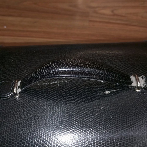 Vintage black jewelry box used with mirror and beige lining