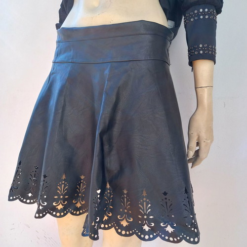 Laser cut skirt made of black faux leather used with handmade details