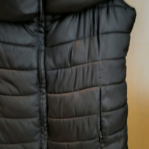 Black sleeveless Spell jacket size medium like new with bow at back