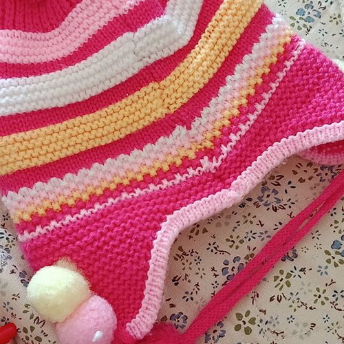 Knitted baby hat with pom pom and cute bunny design, like new