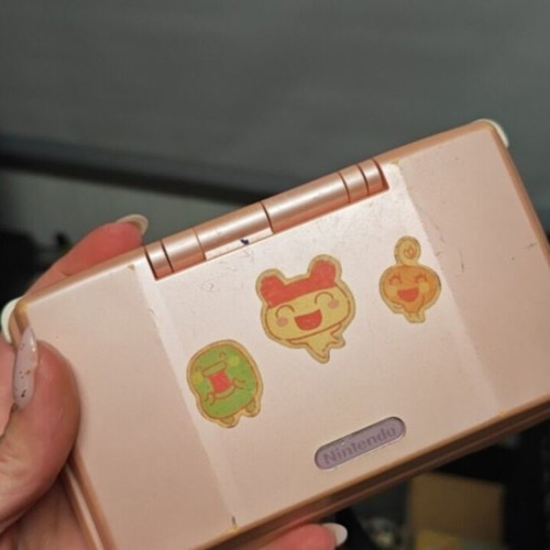 Nintendo DS used, pink with Tamagotchi stickers