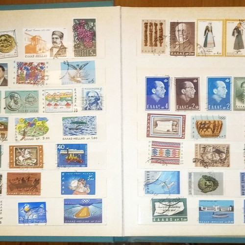 Book with collection of various Greek and foreign stamps used