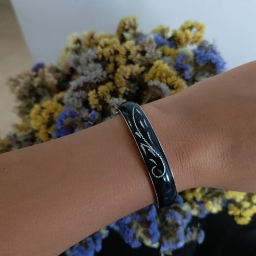 Set of 2 fashion bracelets, black enamel bangle and charm bracelet