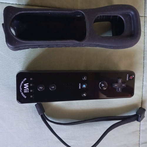 Nintendo Wii black used with Wii Motion Plus controller, nunchuk and 2 games