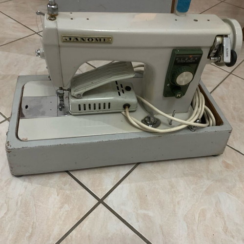 Electric collectible sewing machine used with carrying case