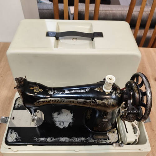 Singer vintage sewing machine with motor and case