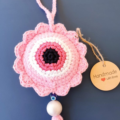 Handmade crochet evil eye in baby pink