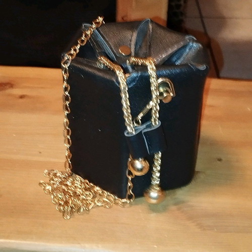 Modern pouch bag like new, black and gold