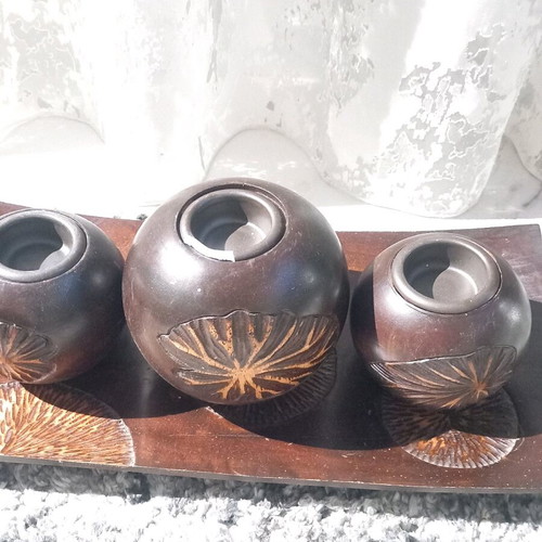 Plate with three wooden candlesticks used