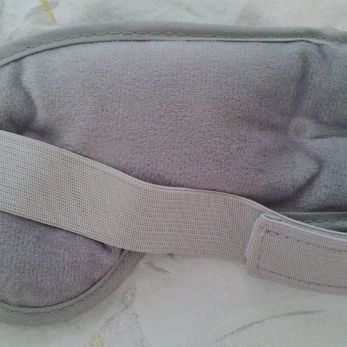 Grey gel mask with velour lining and adhesive closure, like new