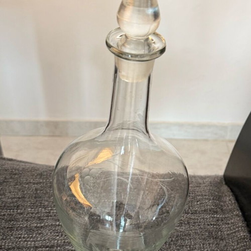 Vintage glass decanter like new with engraved decorative patterns