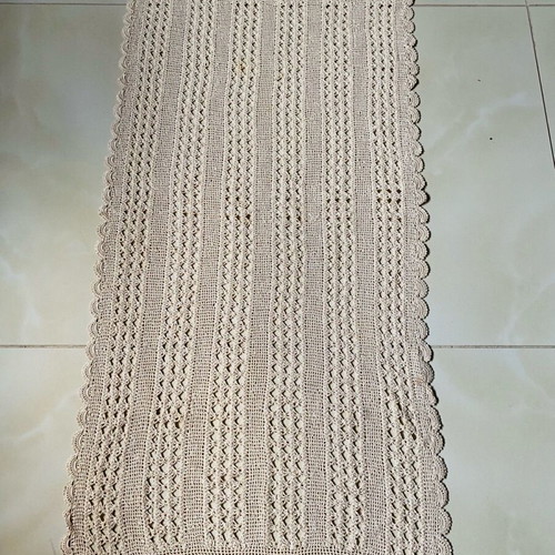 Handmade crocheted table runner used with cotton thread