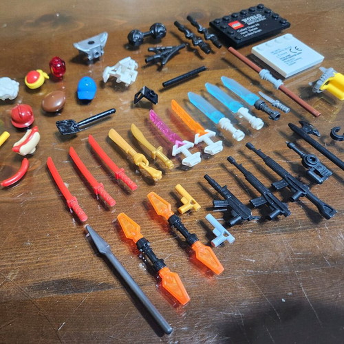 Lego accessory pack used with swords, weapons, hats and armor