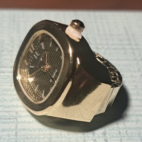 Ring watch with khaki dial and gold bracelet