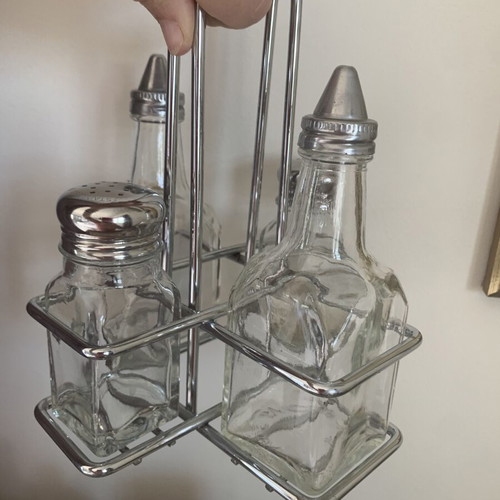 Vintage oil and vinegar set with salt and pepper shakers on metal stand like new