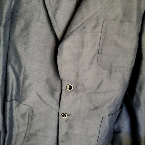 Tailored spring jacket used, hand-stitched
