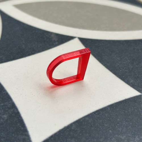 Plexiglass ring like new with red transparent color and unique design