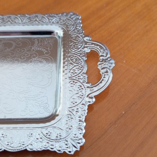 Vintage decorative tray with embossed designs, silver color