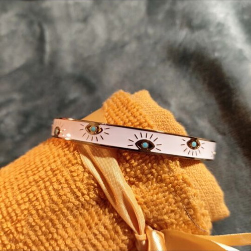 Metal bracelet with eyes like new, white and blue