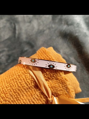 Metal bracelet with eyes like new, white and blue