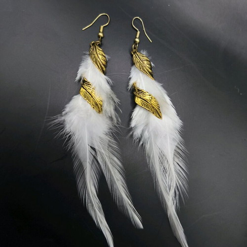 Earrings with white feather new, gold details