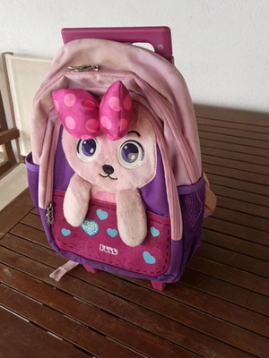 School bag used with wheels and foldable handle