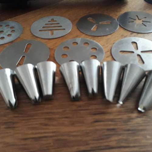 Biscuit press set used with 8 pastry nozzles and 10 dough designs