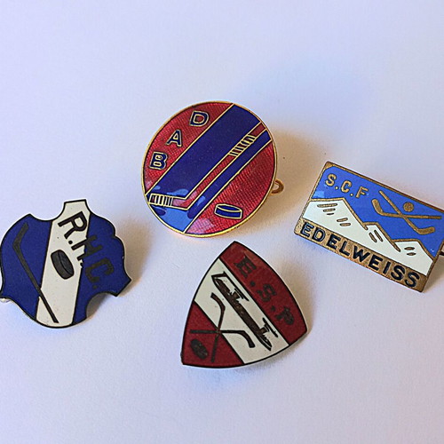 Set of vintage sports enamel pins with hockey theme, used