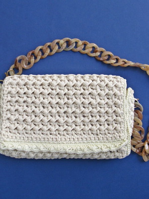 Knitted shoulder bag, handmade, ecru with a bone chain