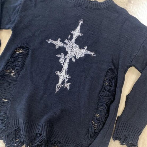Black distressed sweater with white ornate cross graphic
