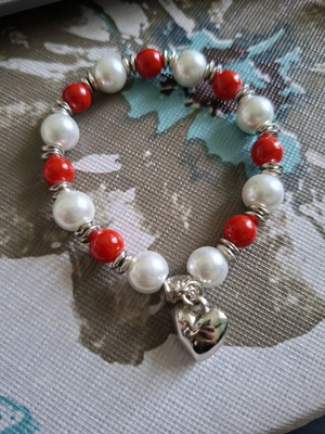 Bracelet with red and white faux pearls and heart pendant used