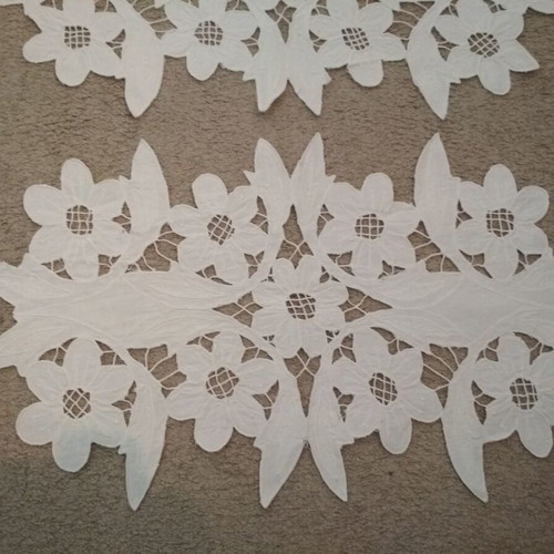 Set of two cut table runners used, white color