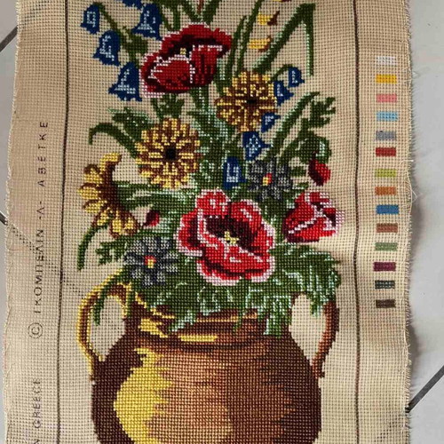 Handmade embroidery artwork with wildflowers in copper pot like new