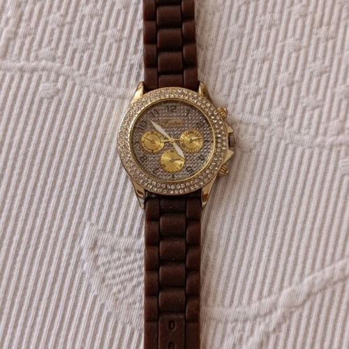 Watch with brown rubber strap and stones on dial like new