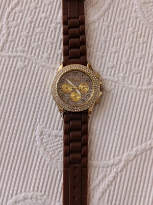 Watch with brown rubber strap and stones on dial like new