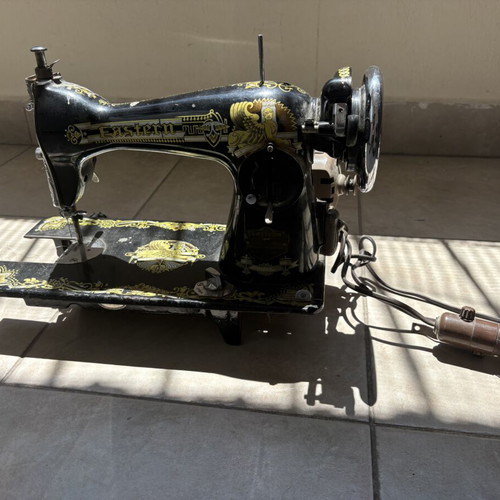 Vintage Eastern sewing machine used with gold Egyptian designs