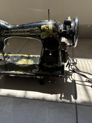 Vintage Eastern sewing machine used with gold Egyptian designs