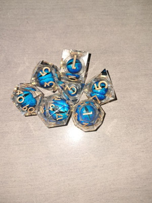 Blue moving dragon eye D&D dice set with bag