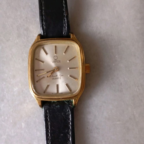 Venus women's watch like new with black leather strap and gold details