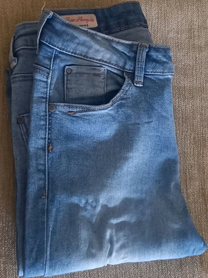 High-waisted blue jeans with rips like new, size S