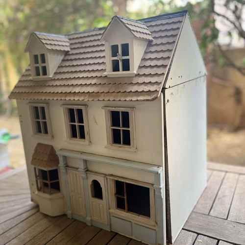 Vintage wooden dollhouse used with unique architecture