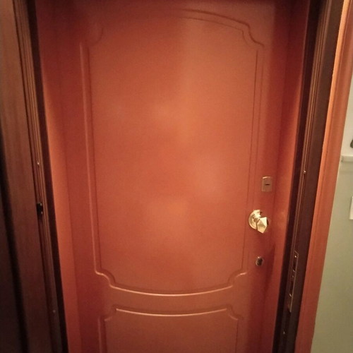 Lacquered entrance door used, terracotta exterior, white interior
