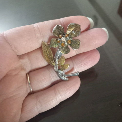 Flower pin used, orange and gold colors
