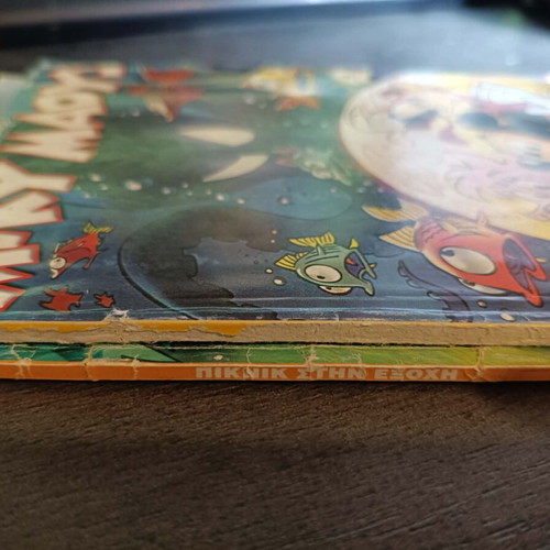 Mickey Mouse and Donald Duck comic used with cover wear