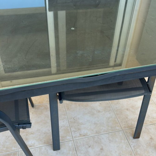 Garden table with glass top and 2 chairs used
