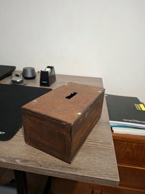 Wooden handmade money box with screws