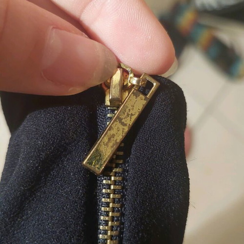 Mini black dress like new with zipper and gold details