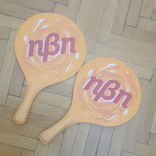 Wooden rounded beach paddles, orange