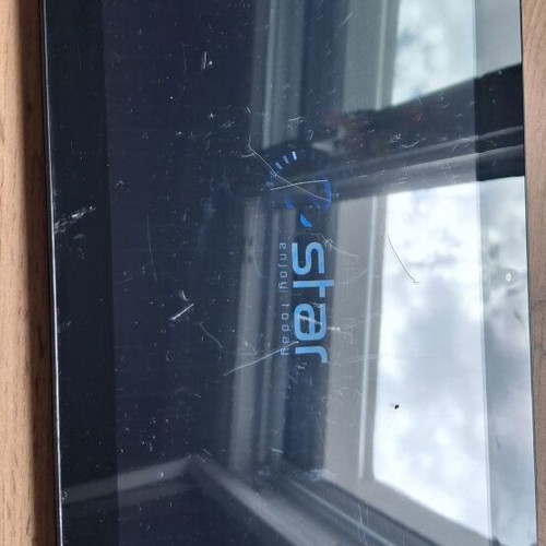 E Star tablet used, for parts or use, with charging cable