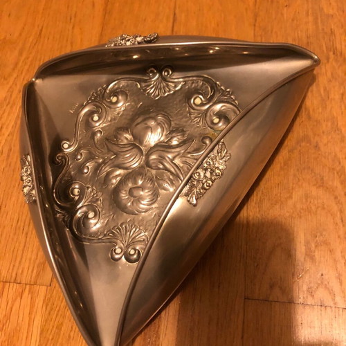 Decorative triangular vessel used with embossed flowers